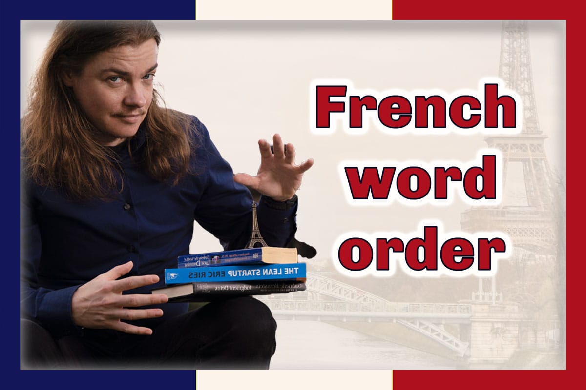 Angel Pretot sits balancing three books and a toy Eiffel Tower on his lap, looking at the camera. The words French word order in red outlined in white at right